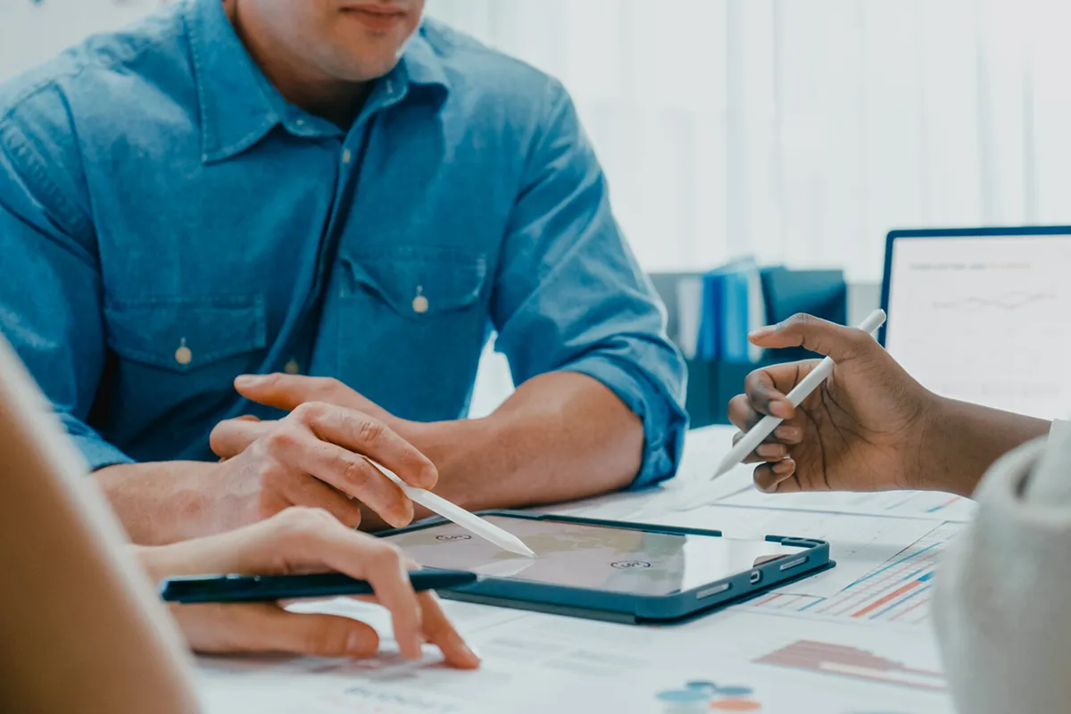 a man writing on a tablet