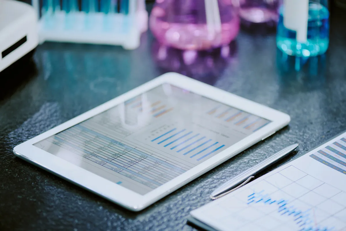a tablet displaying a chart 