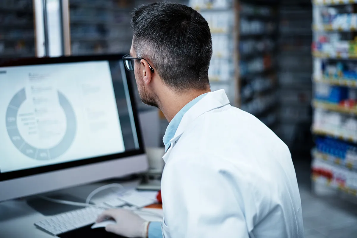 a man in white coat working